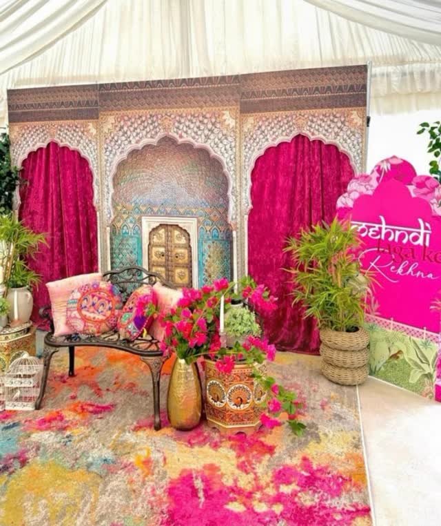 Indian wedding mandap with vibrant florals and rich draping